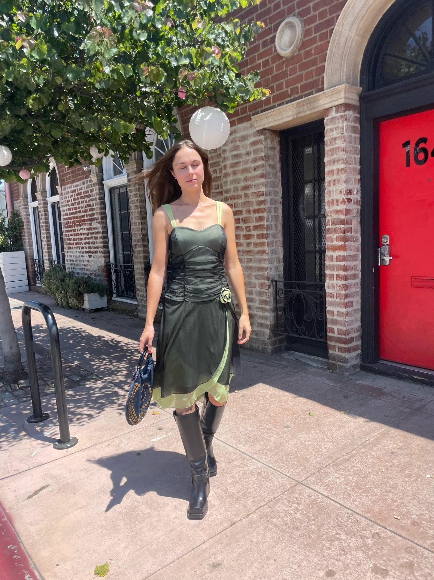 girl in black and green dress