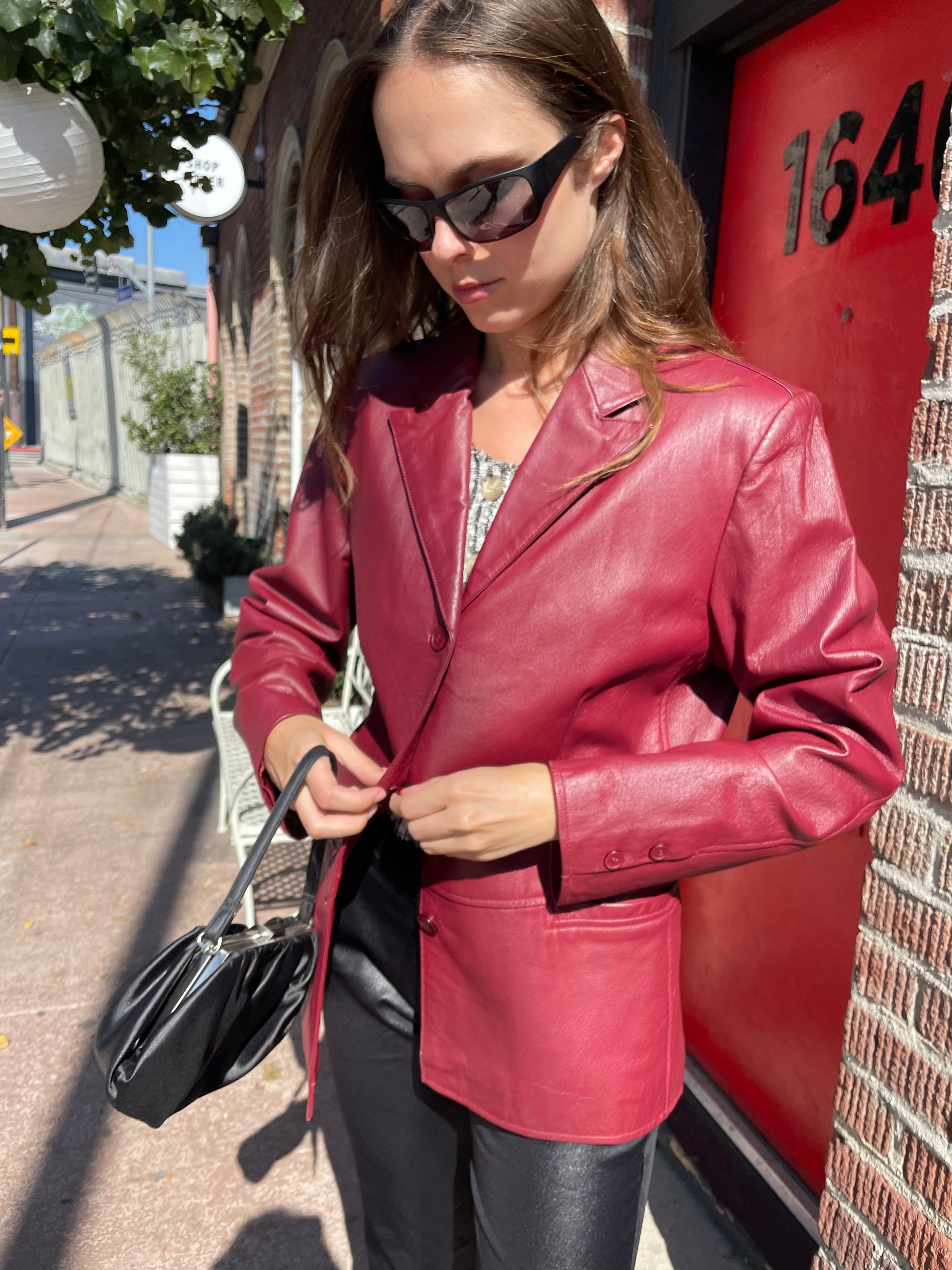 girl in red leather jacket and black leather pants