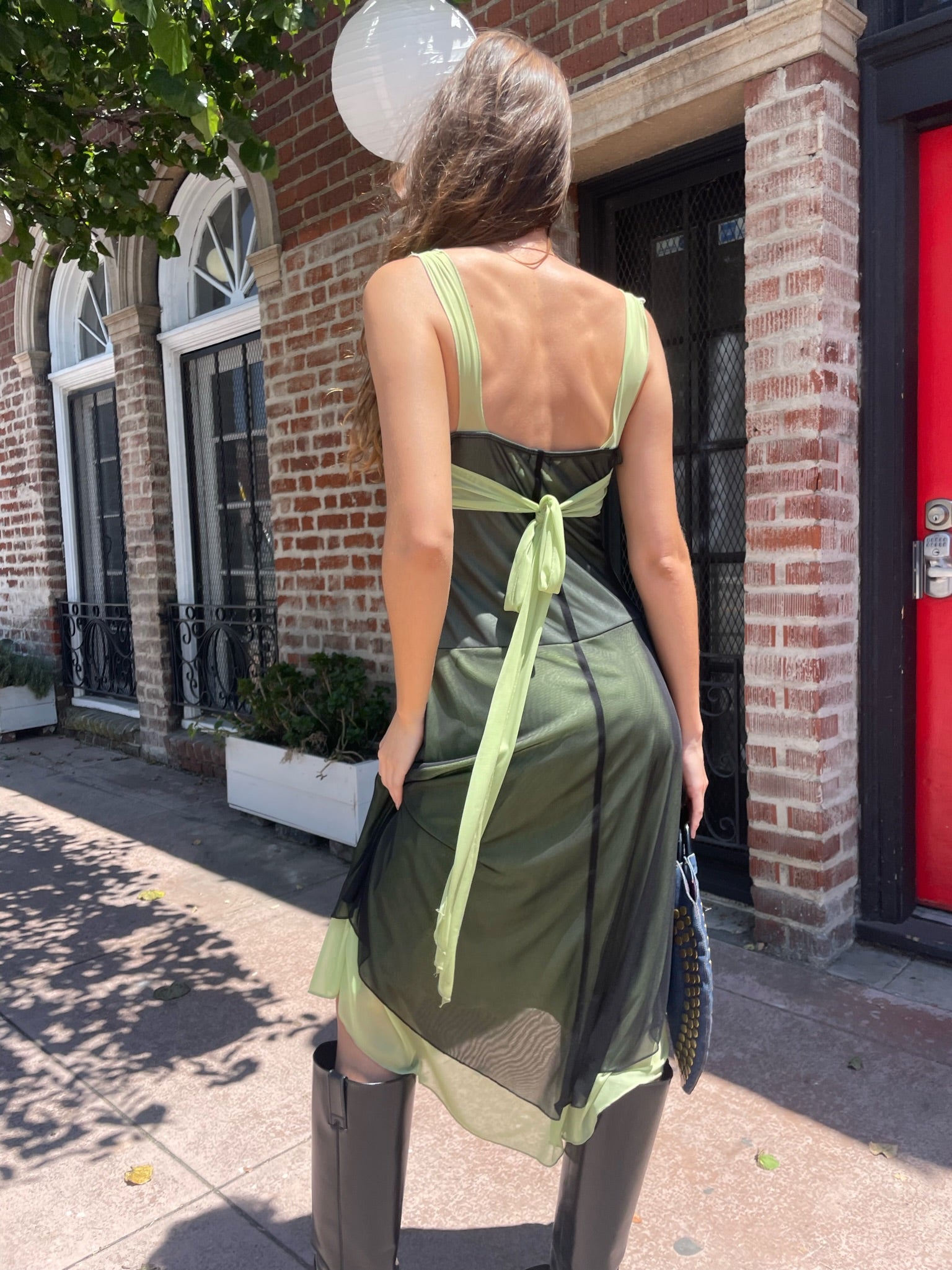 girl in black and green dress