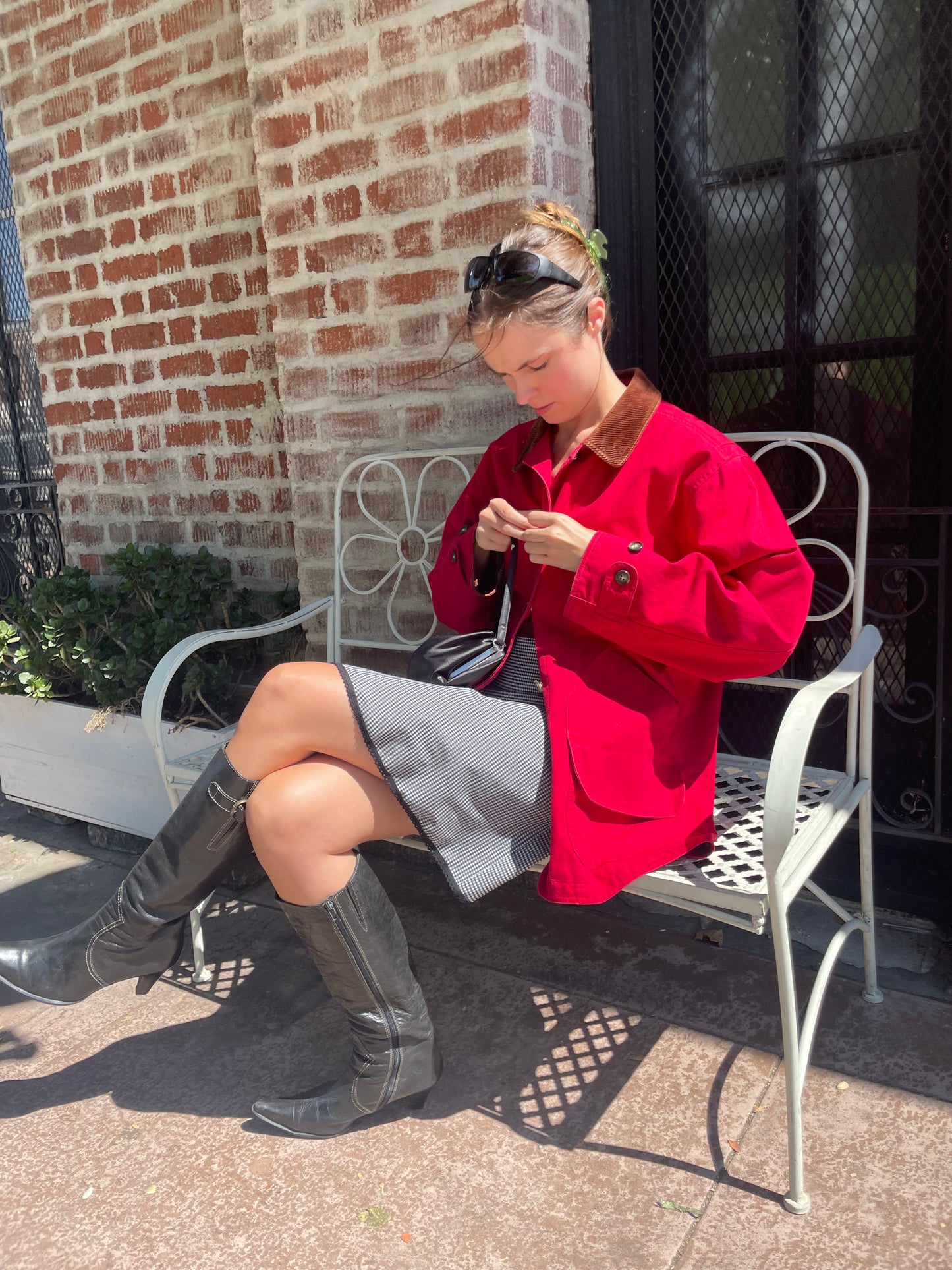 girl in red jacket and black and white skirt
