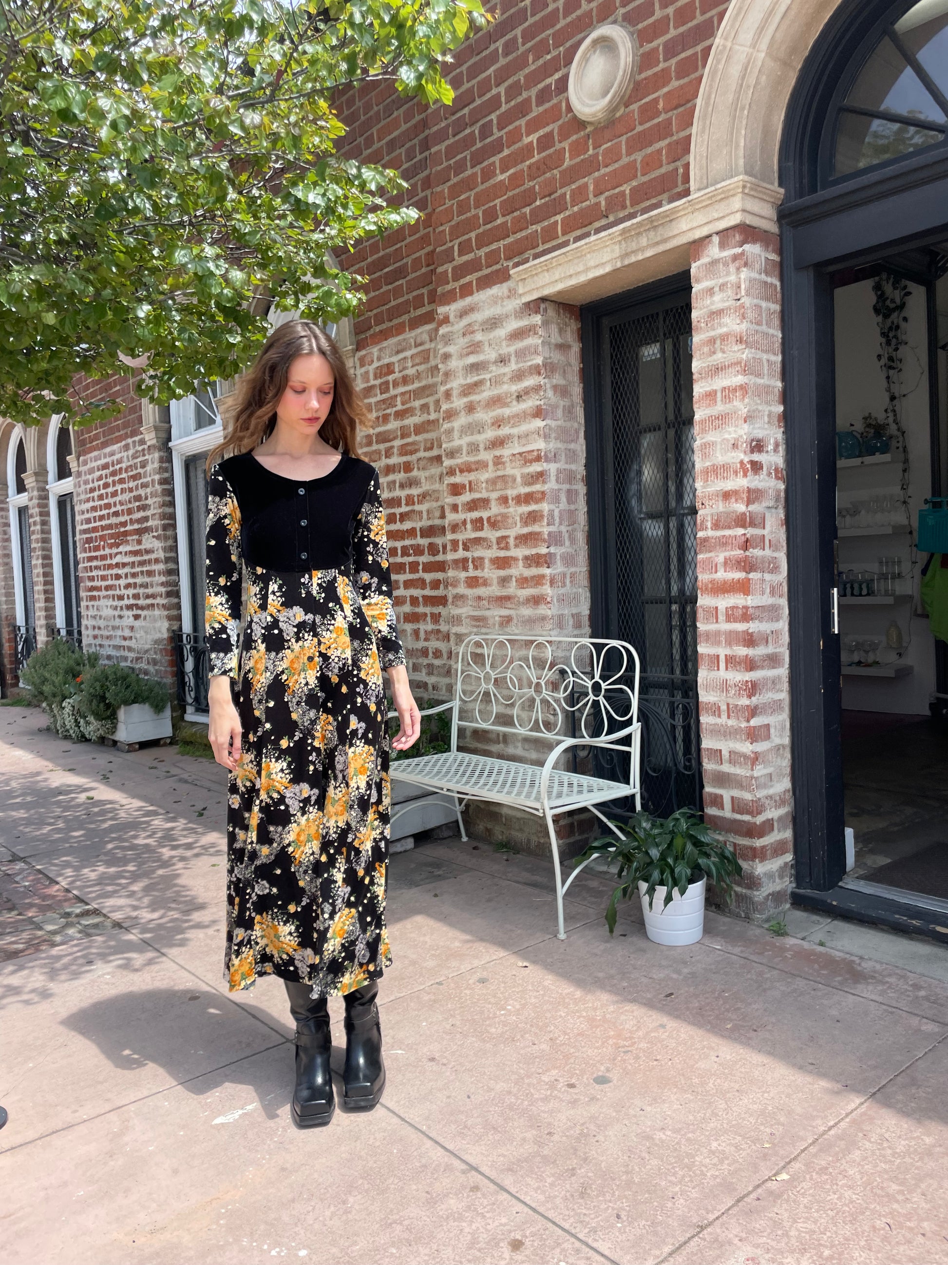 girl wearing long sleeve black and yellow dress