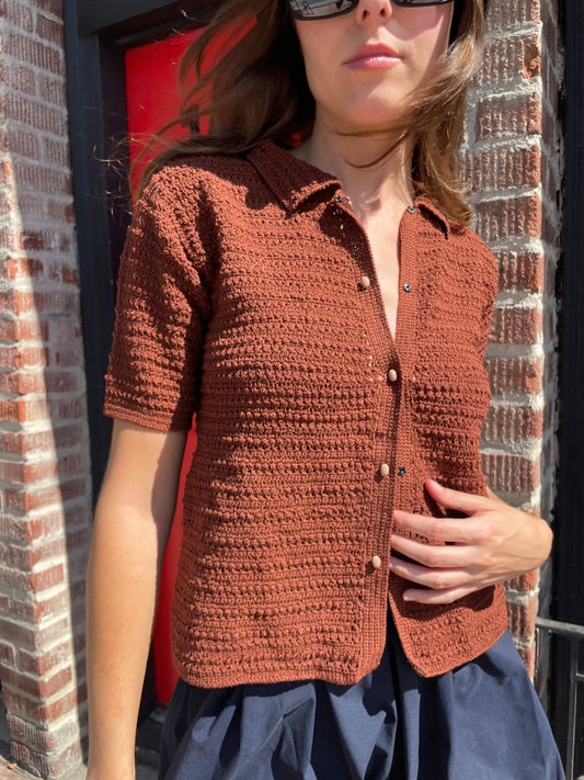 girl in navy skirt and brown button up