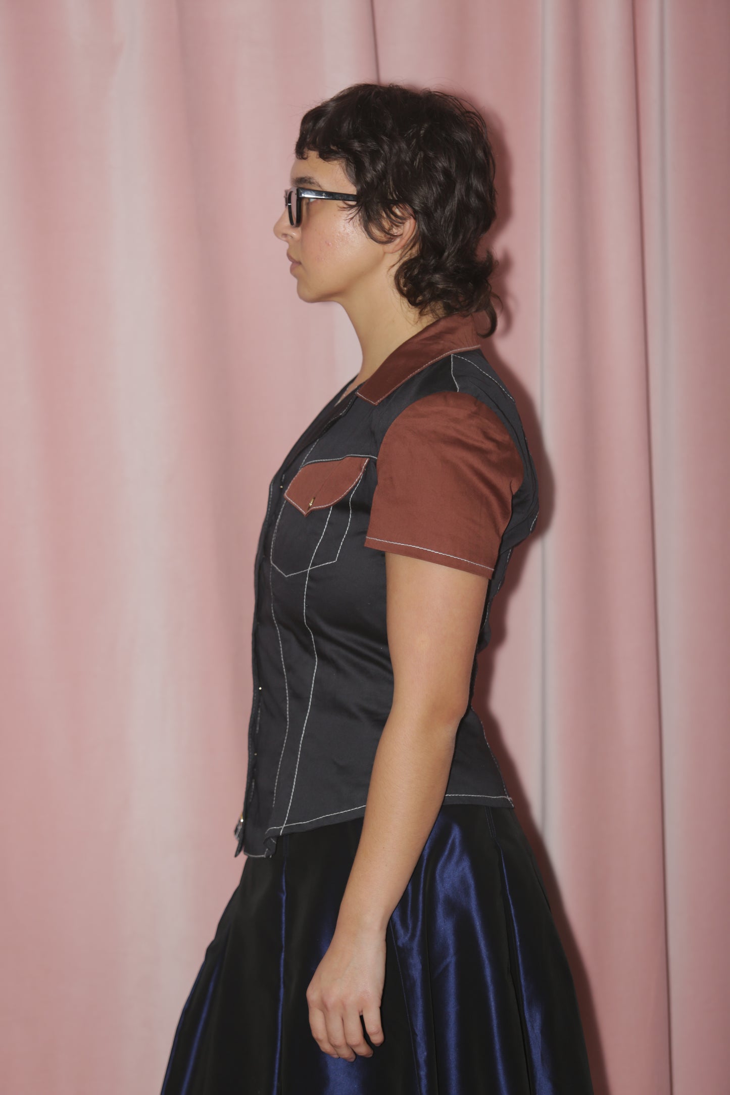 girl in Two Toned Brown & Black Blouse