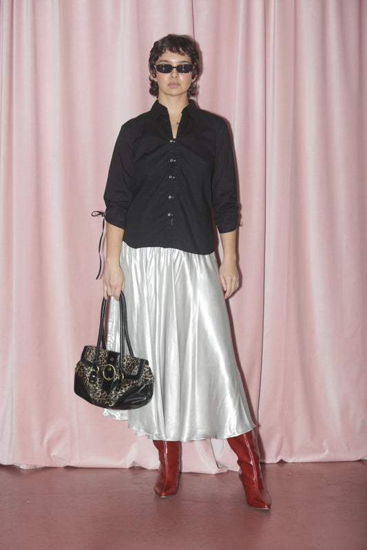 girl in silver skirt