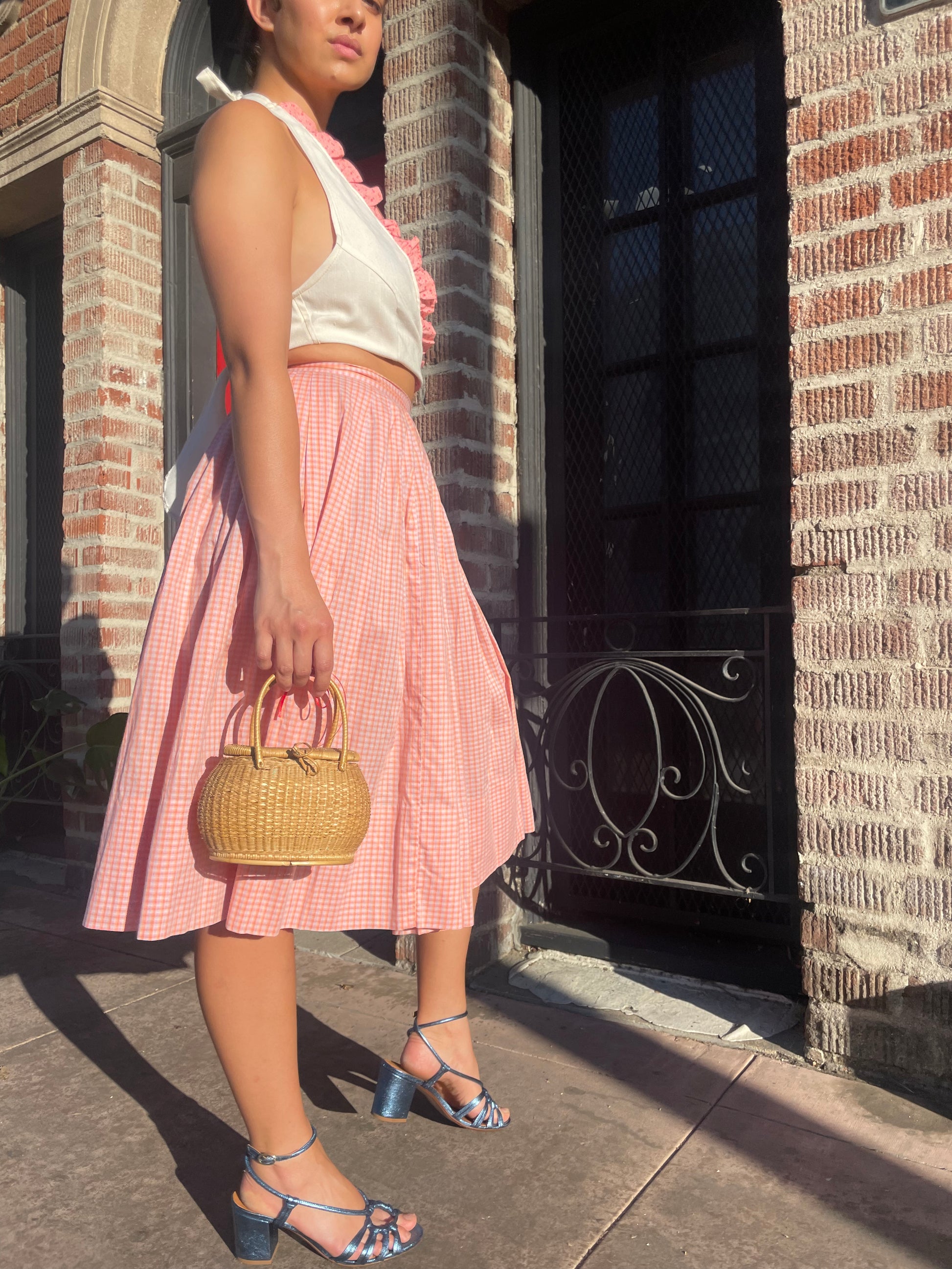 girl in cream halter and pink skirt