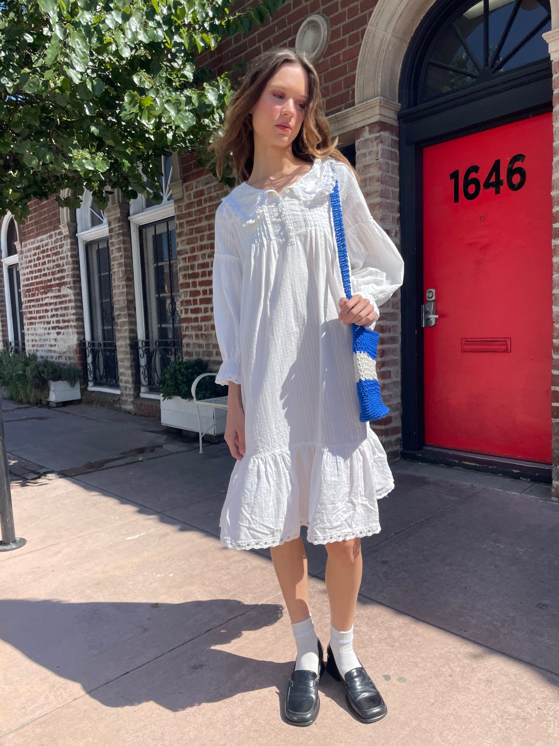 girl in long sleeve white dress