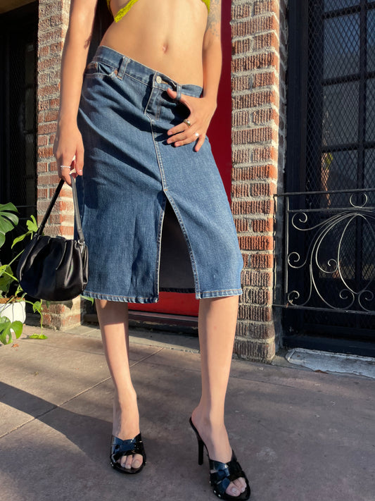 girl in green top and denim skirt