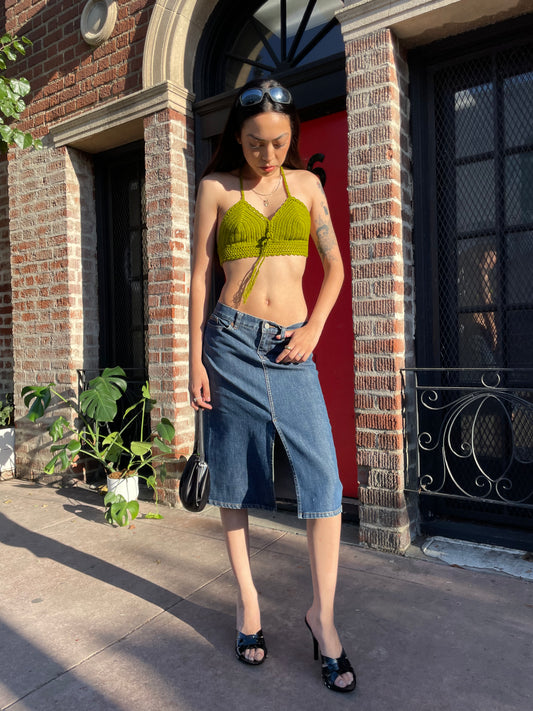 girl in green top and denim skirt