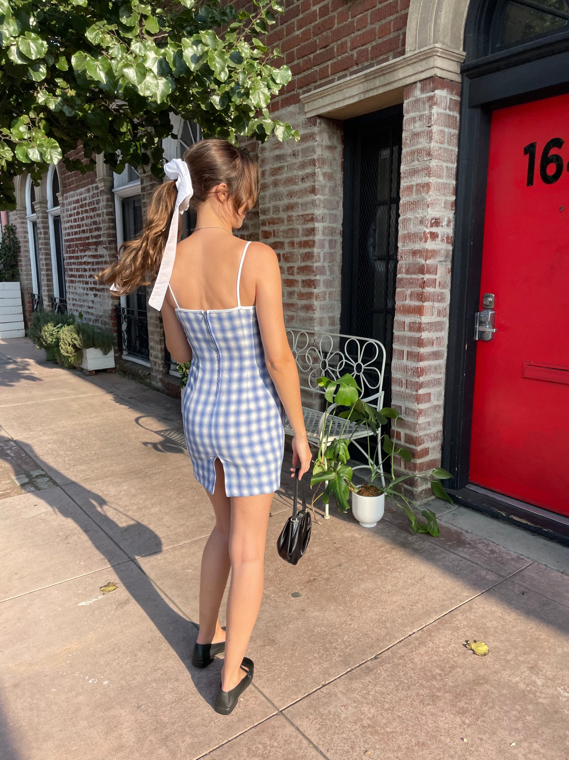 girl in blue gingham dress