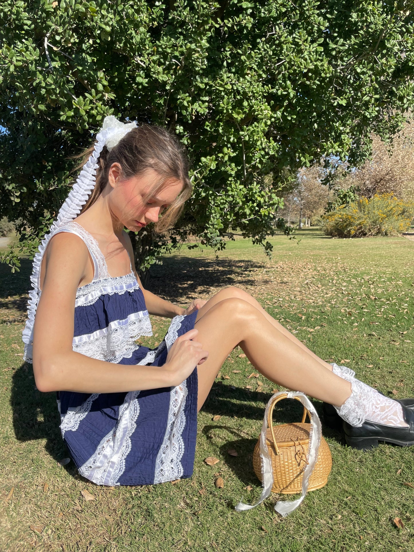 girl in blue and white lace dress