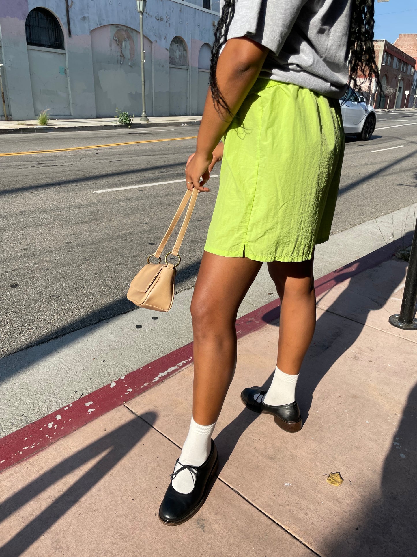 Girl wearing lime green runner shorts