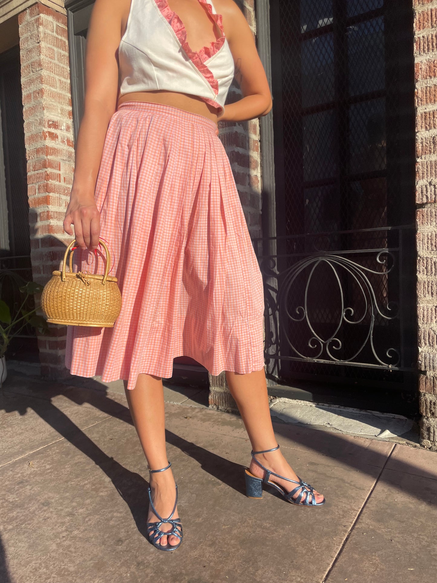 girl in cream halter and pink skirt