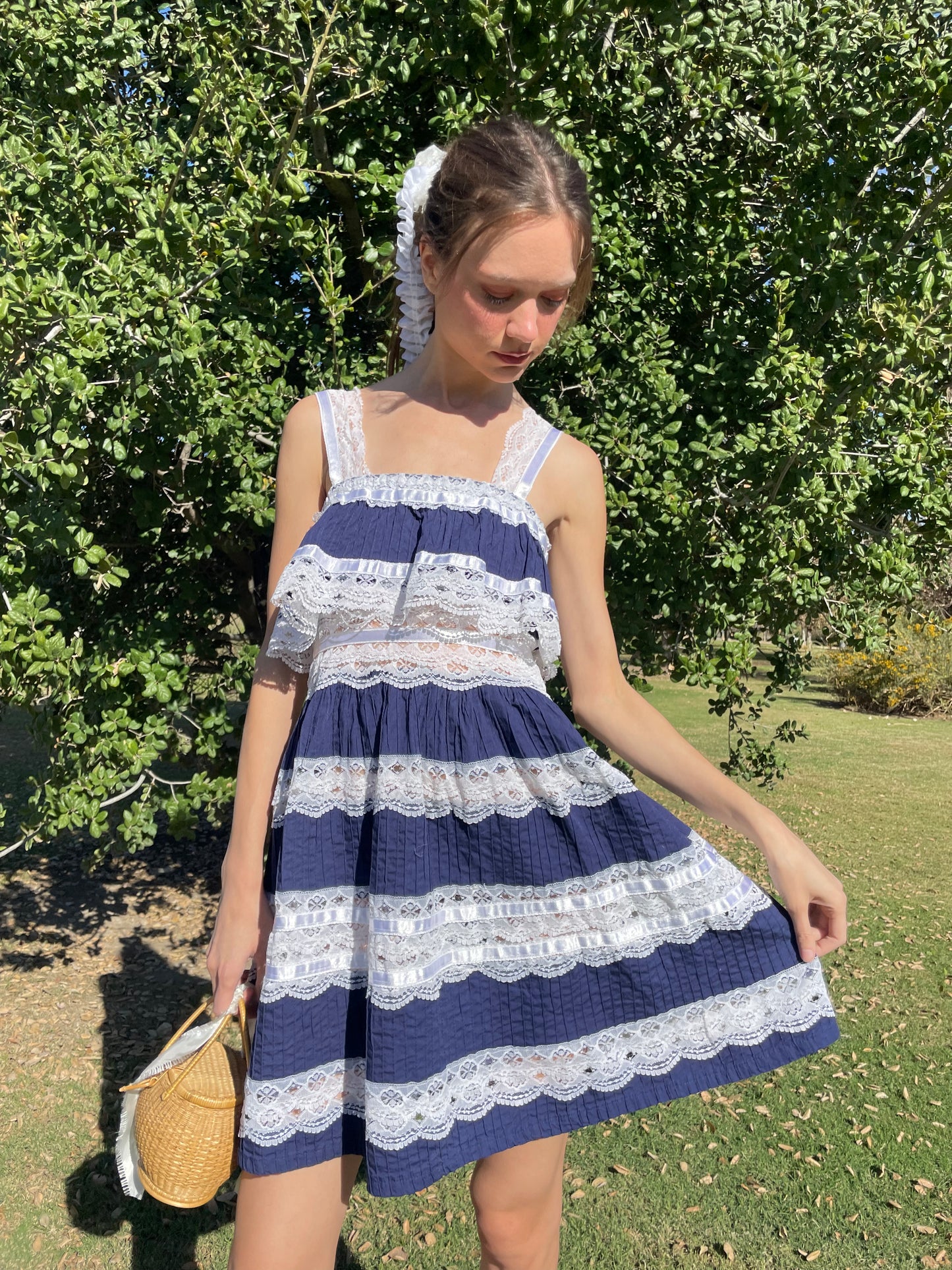 girl in blue and white lace dress