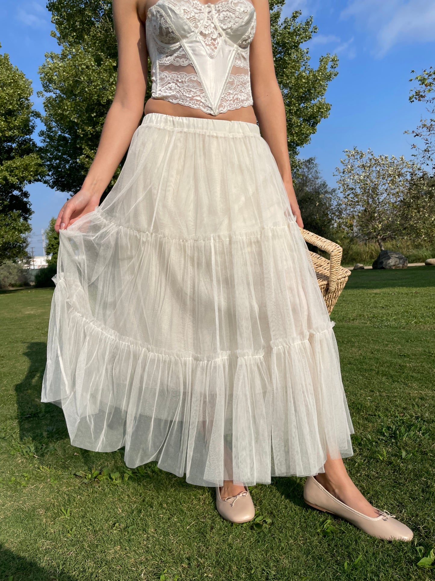 girl in white corset and tulle skirt