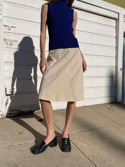 girl in cream knee skirt