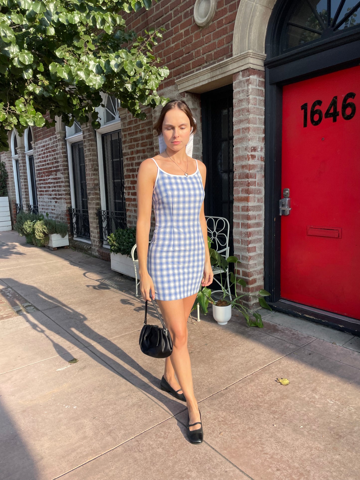 girl in blue gingham dress