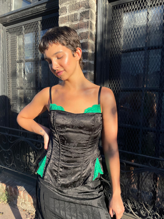 girl in black and green corset 
