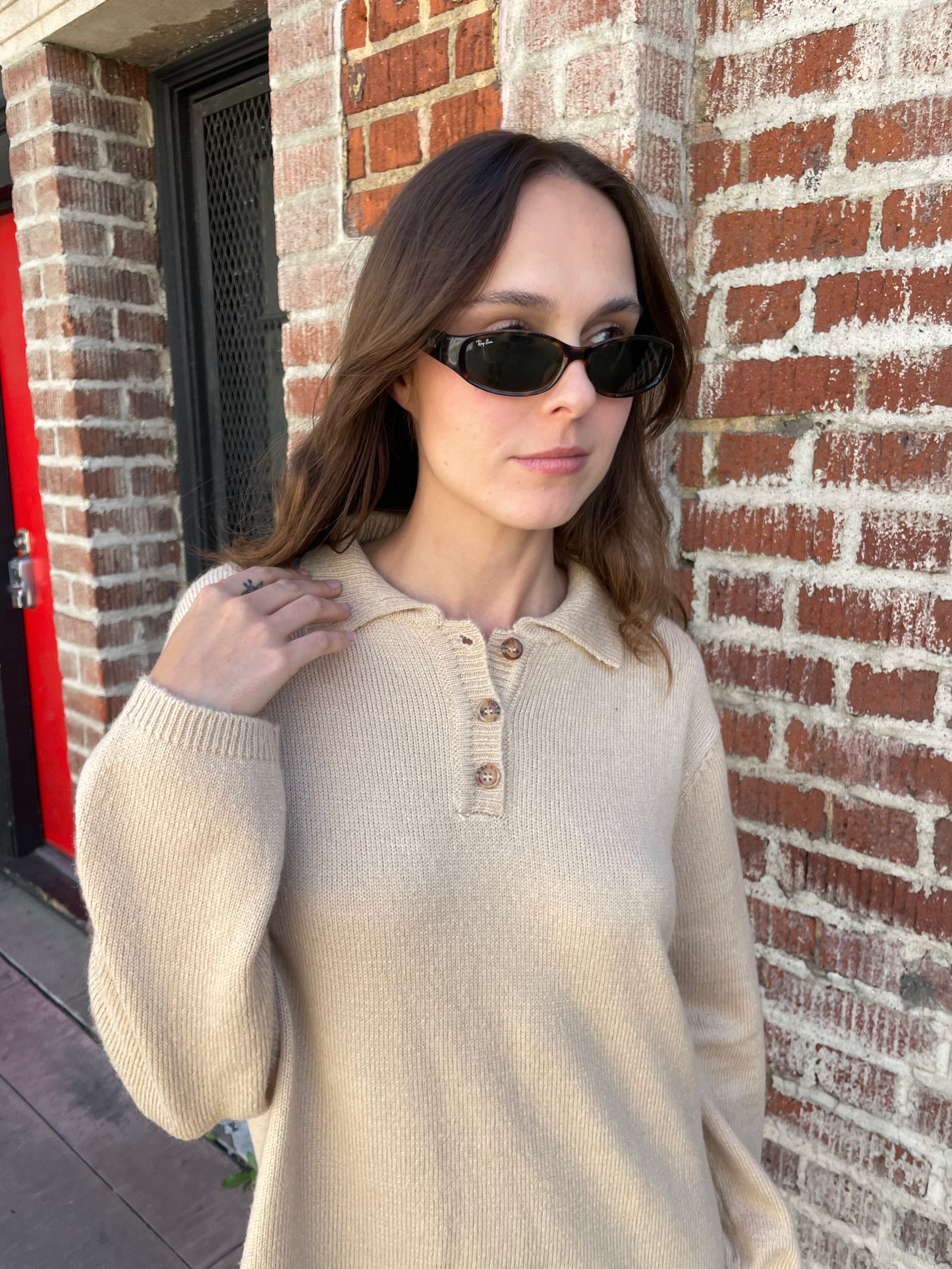 girl in tan sweater dress