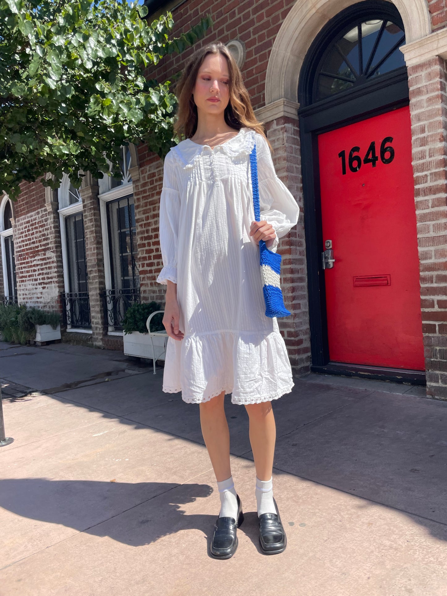 girl in long sleeve white dress