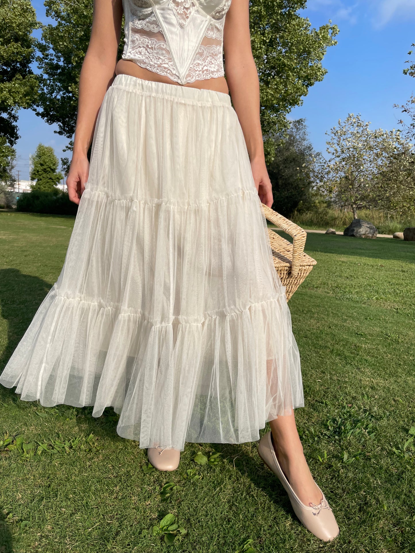 girl in white corset and tulle skirt