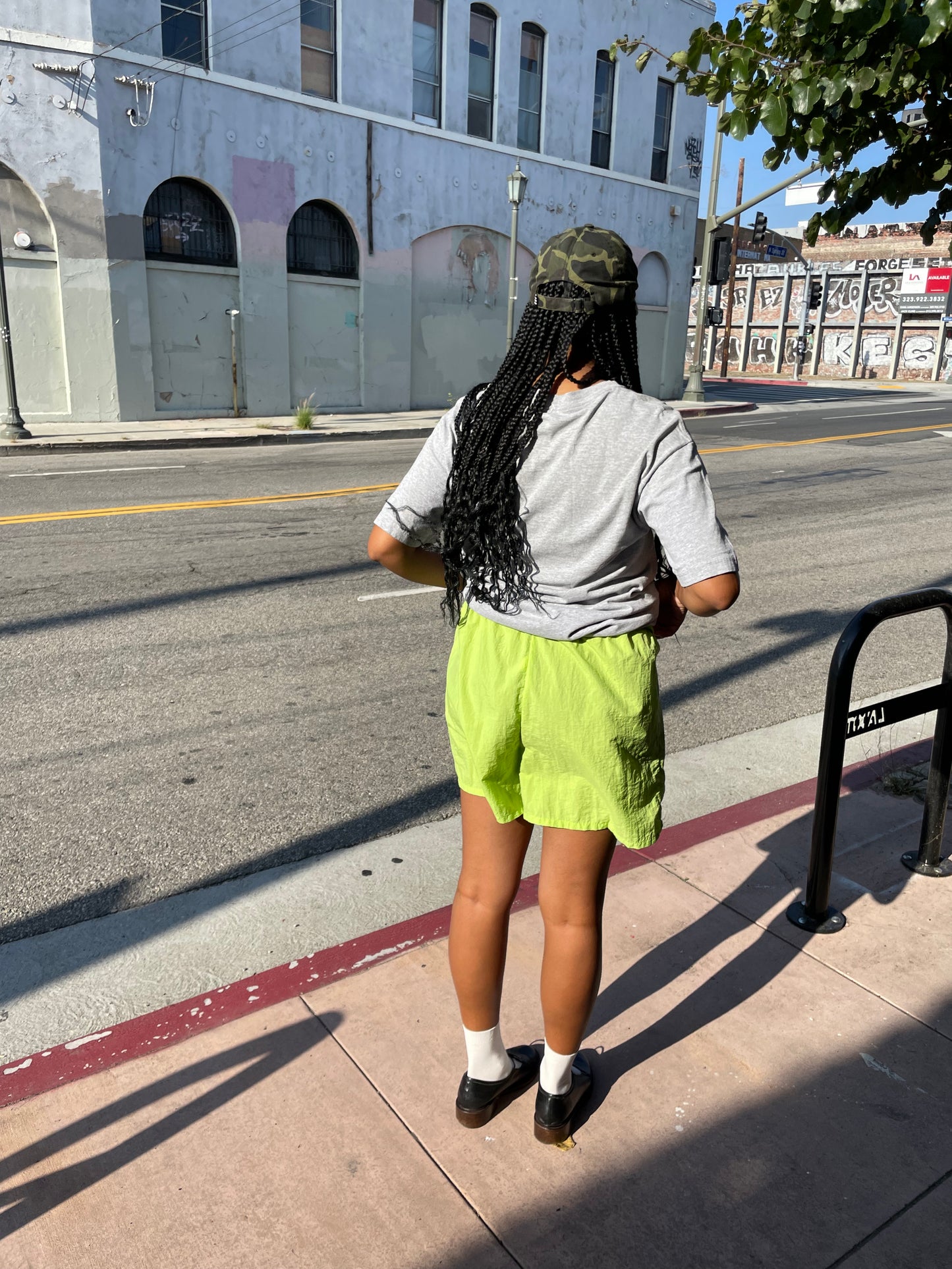 Girl wearing lime green runner shorts