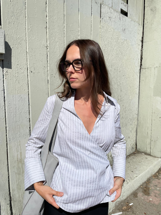 girl in striped wrapped button down top