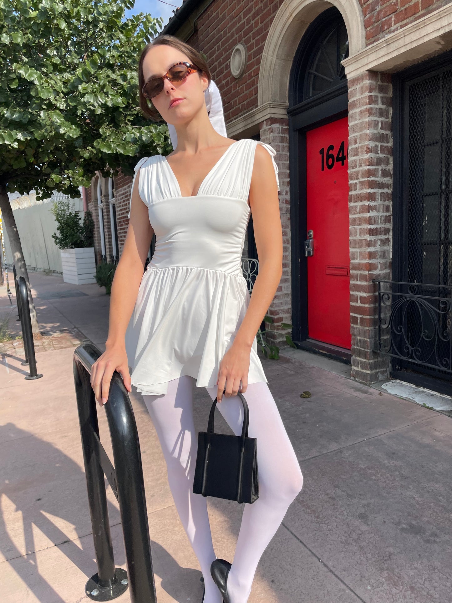 girl in white dress and white tights