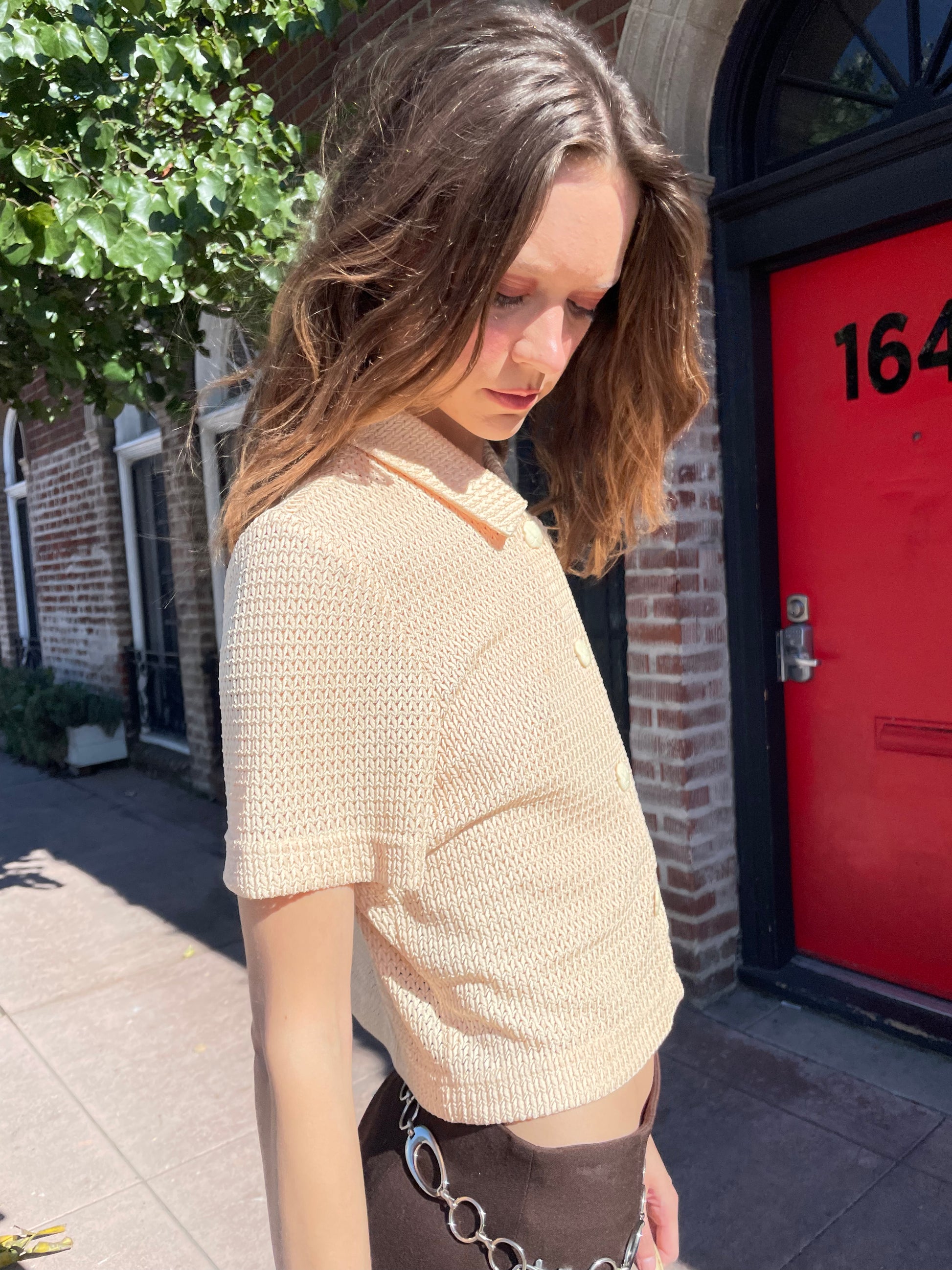 girl in yellow top and brown skirt