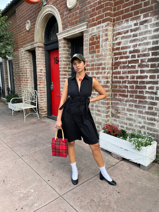 girl in black sleeveless dress