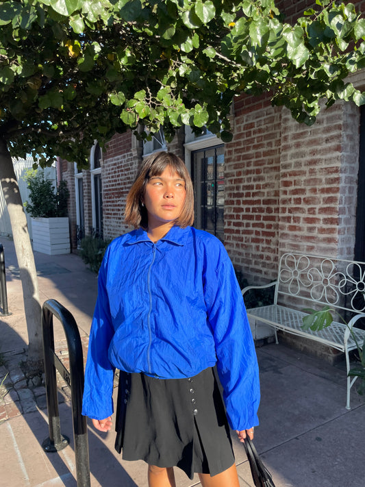 girl in blue jacket and black mini skirt