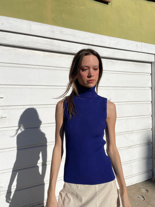 girl in blue turtleneck top