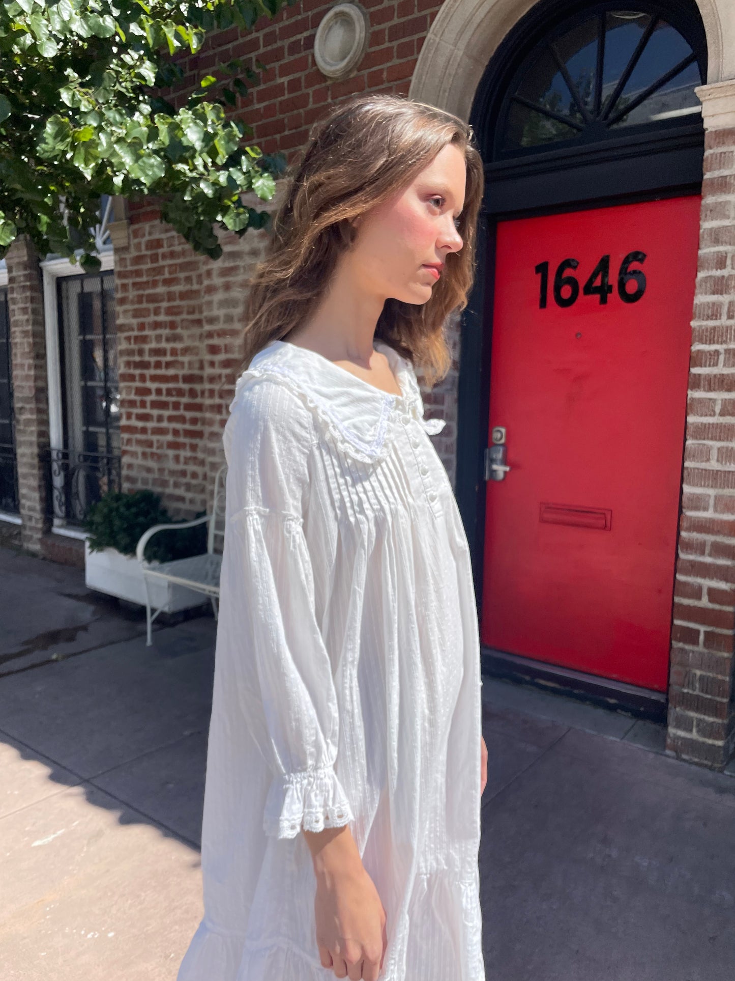 girl in long sleeve white dress