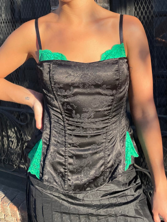 girl in black and green corset 