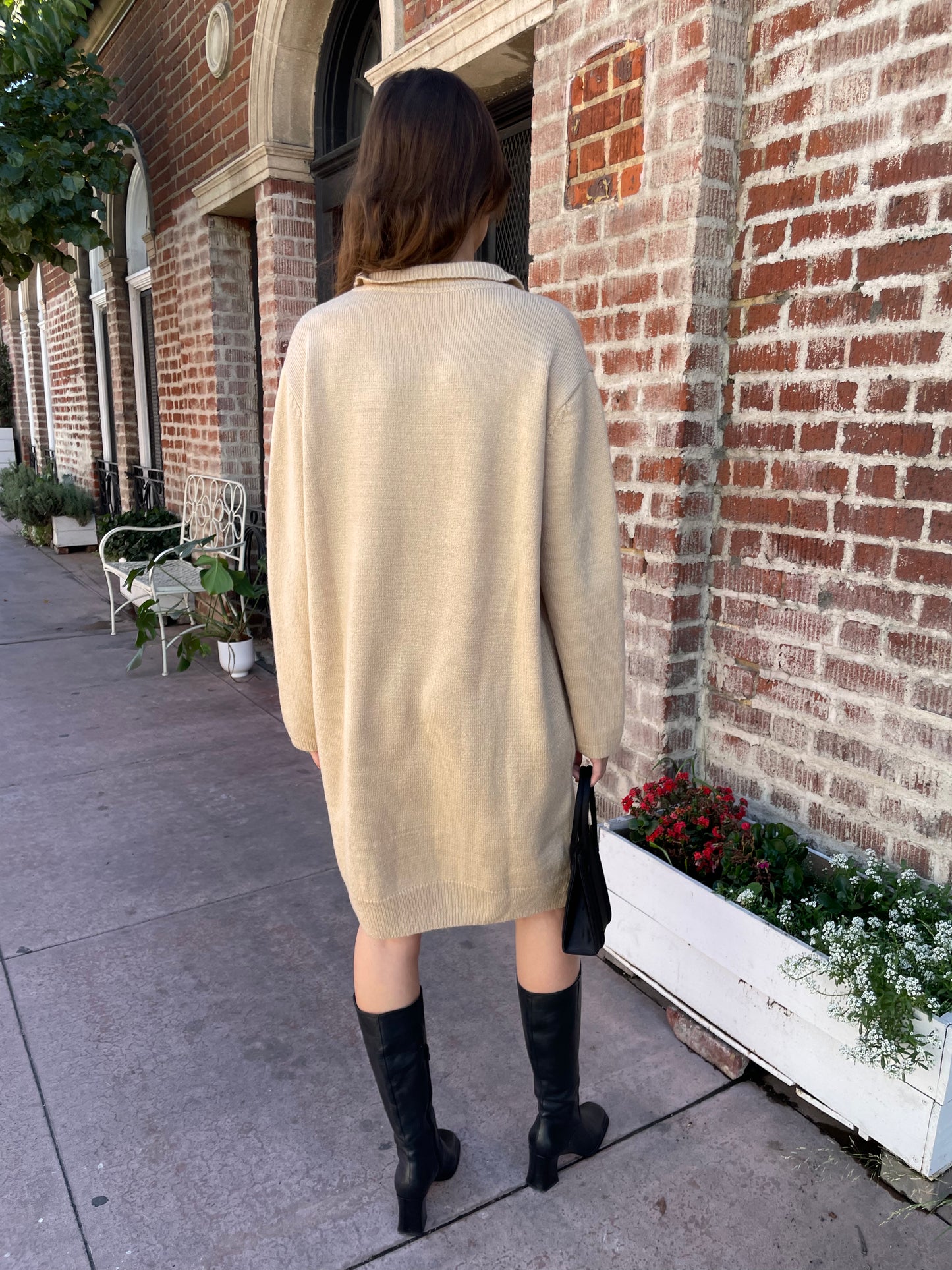 girl in tan sweater dress