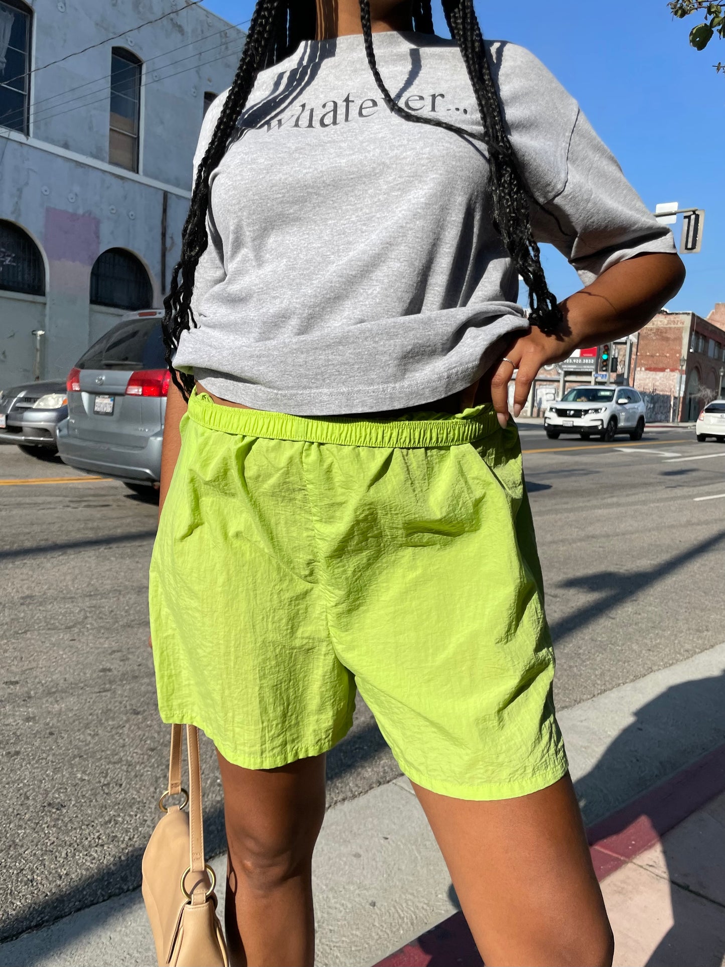 Girl wearing lime green runner shorts