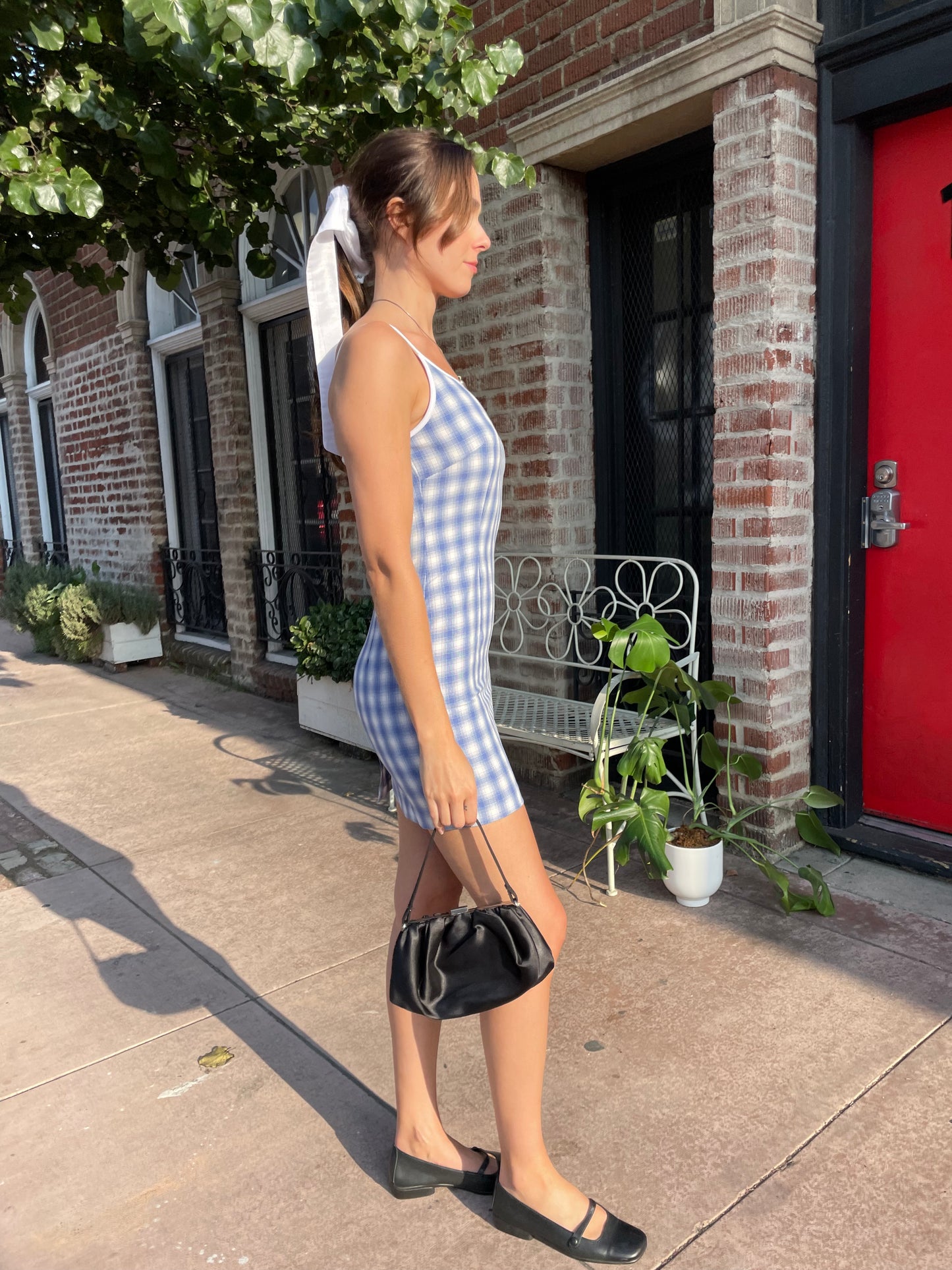 girl in blue gingham dress