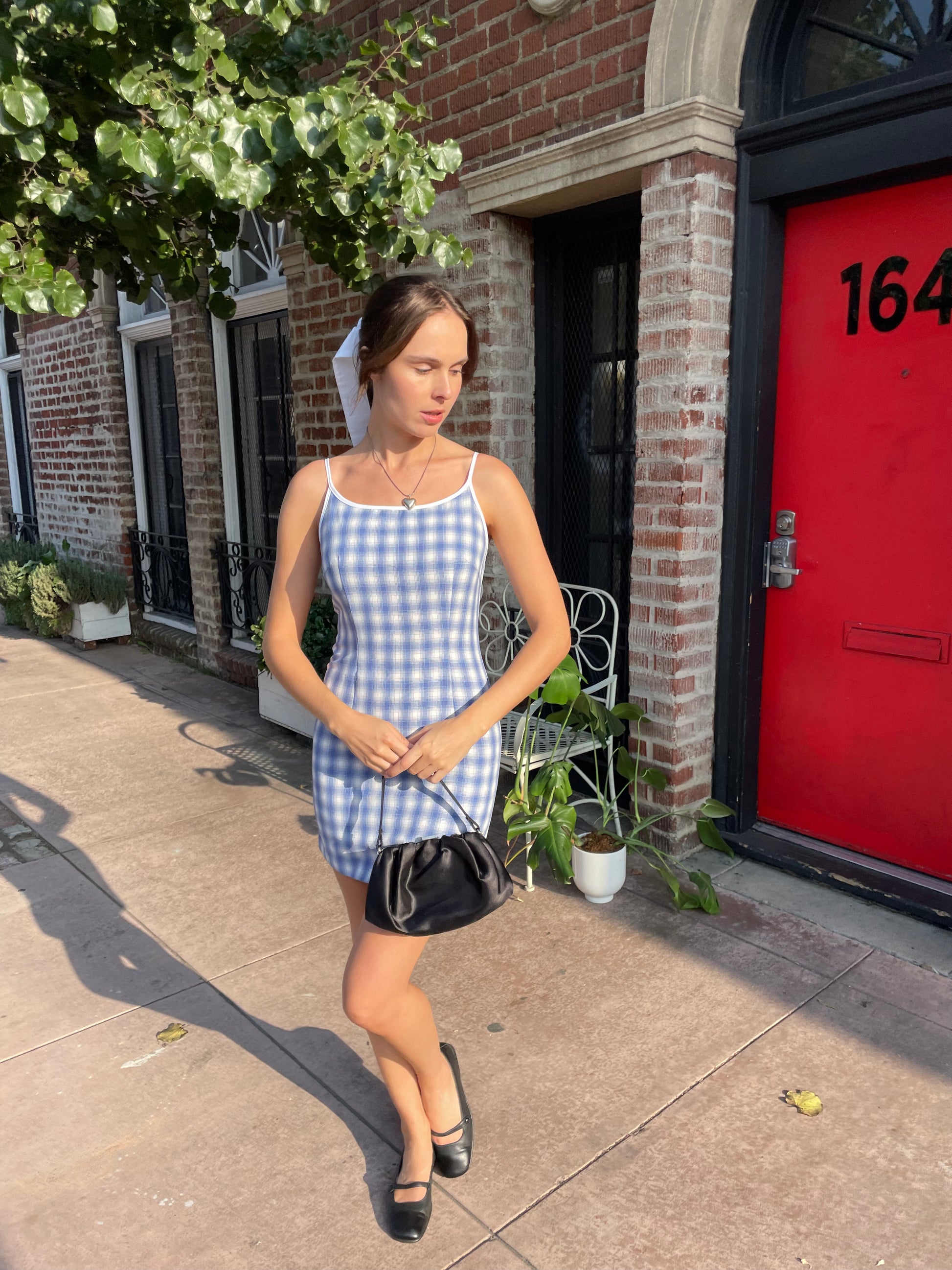 girl in blue gingham dress