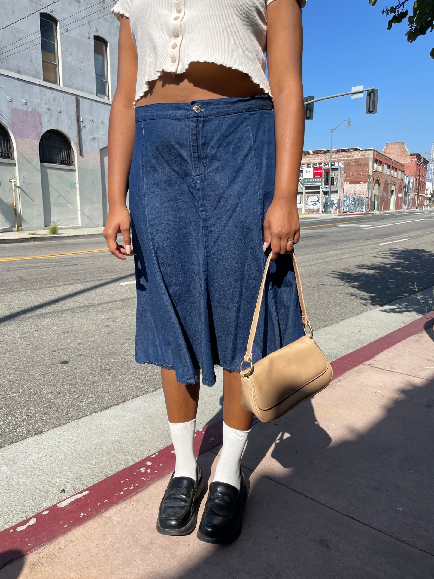 girl wearing denim skirt