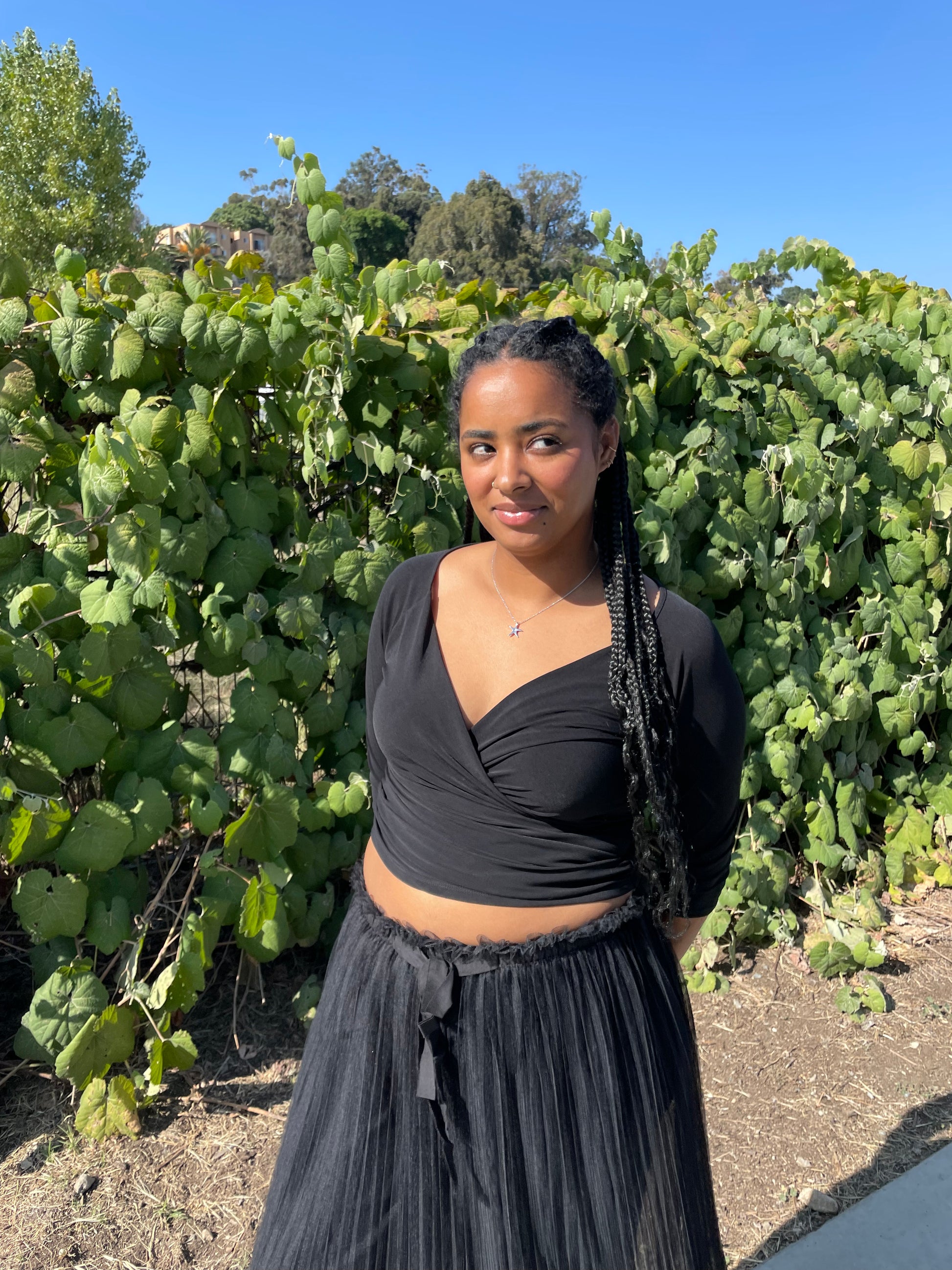 girl wearing black wrap top