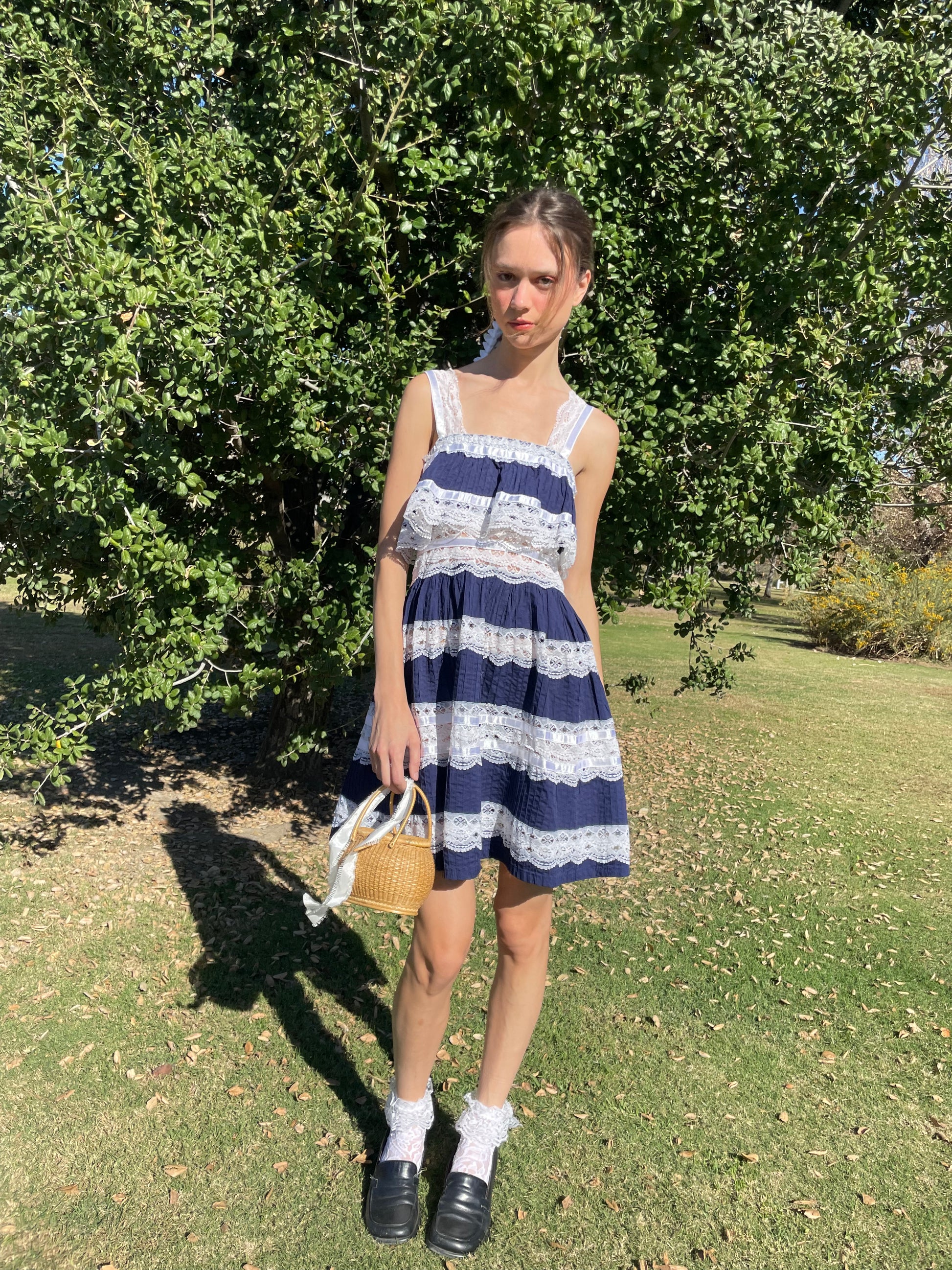 girl in blue and white lace dress