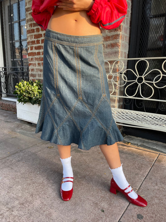 girl in red jacket and denim skirt