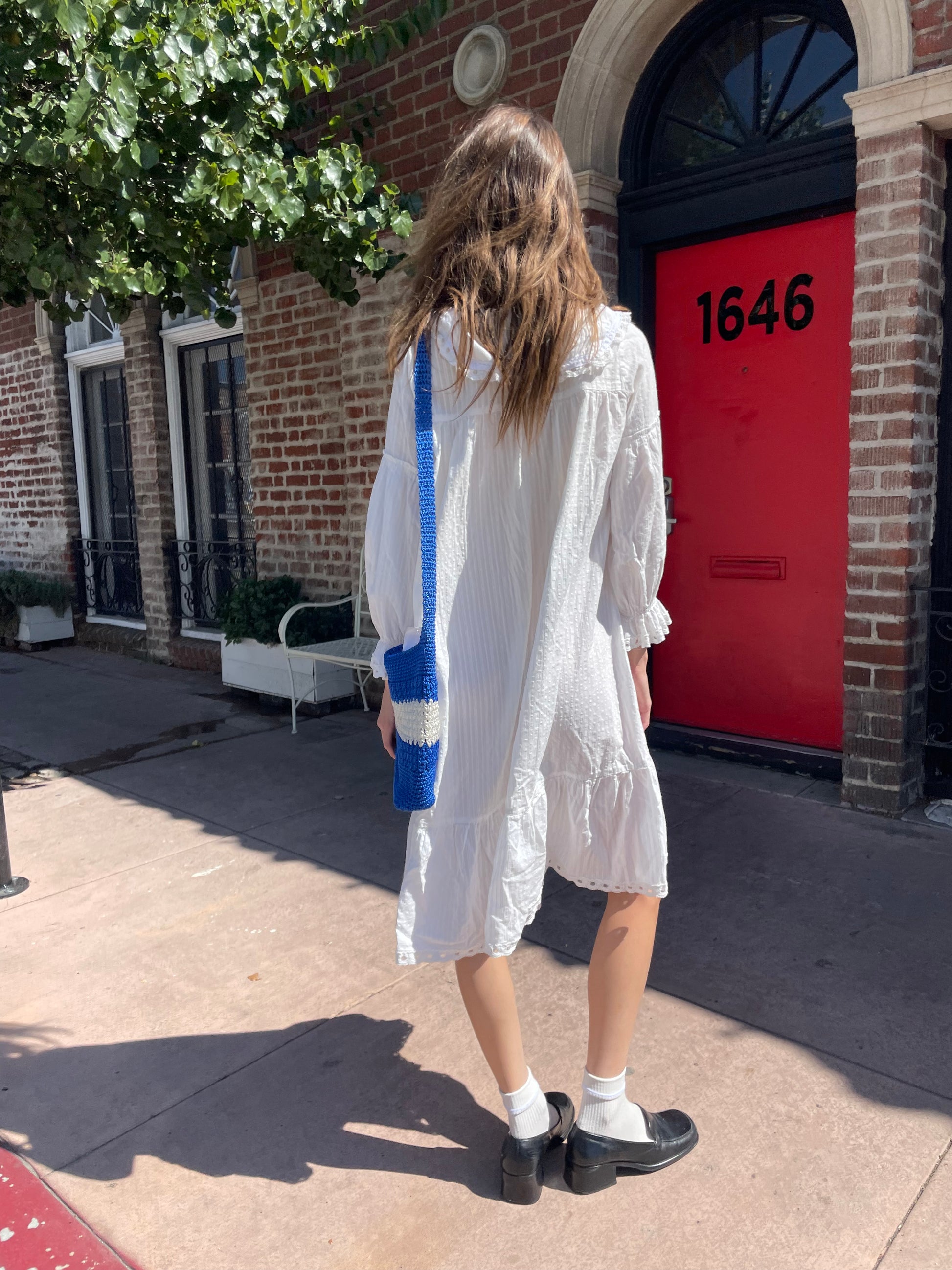 girl in long sleeve white dress