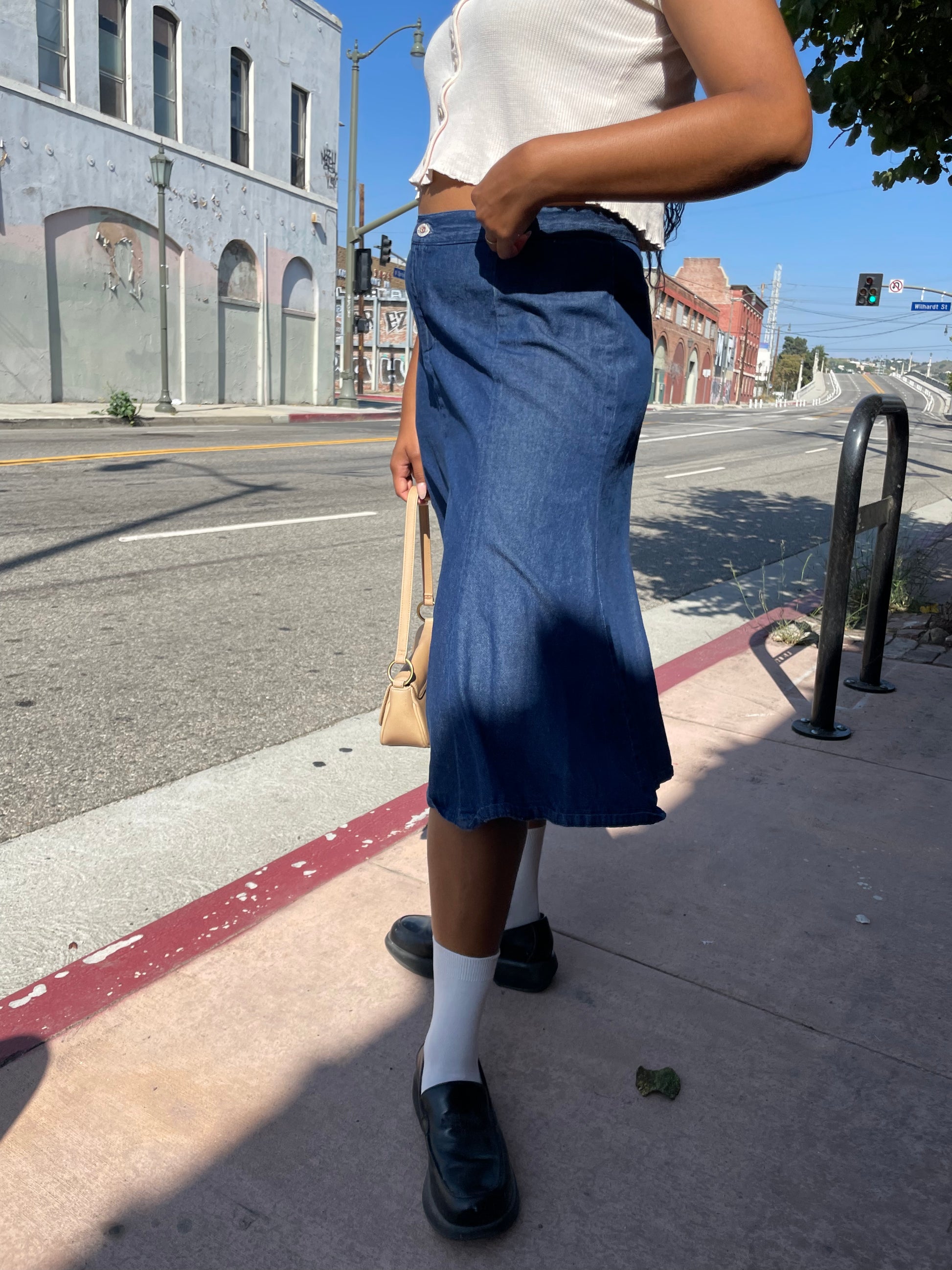 girl wearing denim skirt