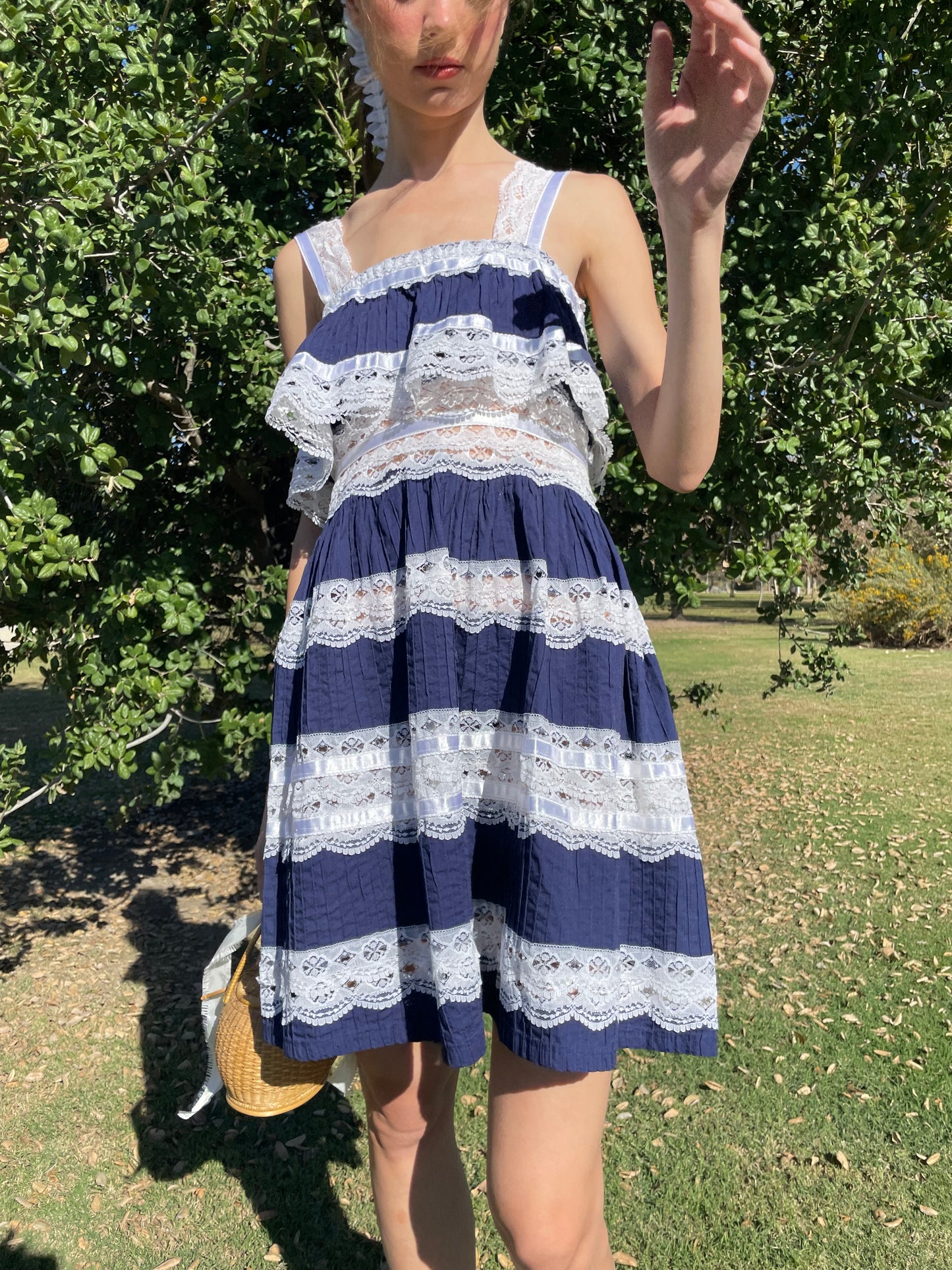 girl in blue and white lace dress