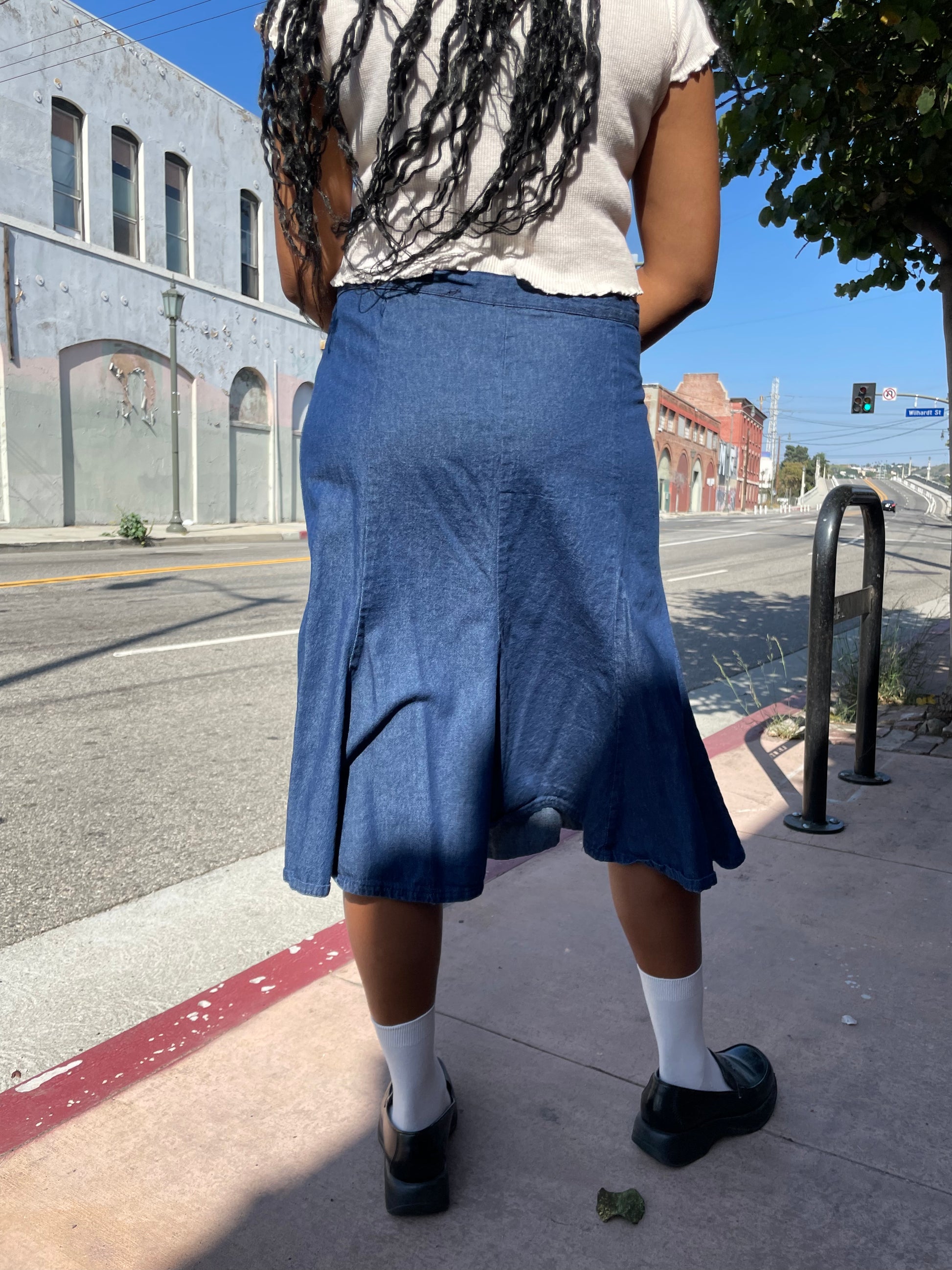 girl wearing denim skirt