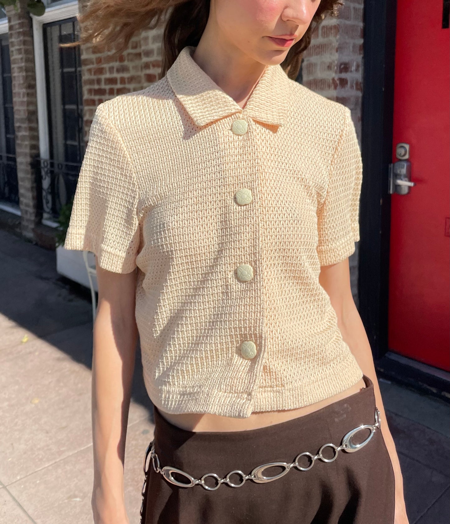 girl in yellow top and brown skirt