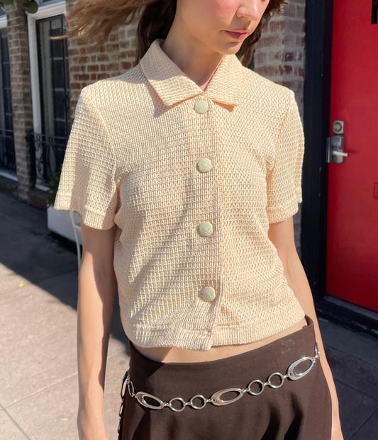 girl in yellow top and brown skirt