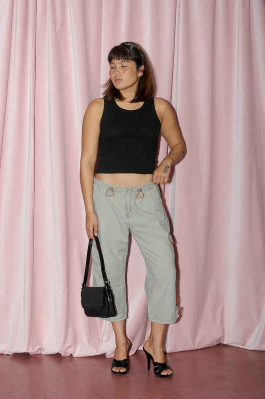 girl in green capri and black tank