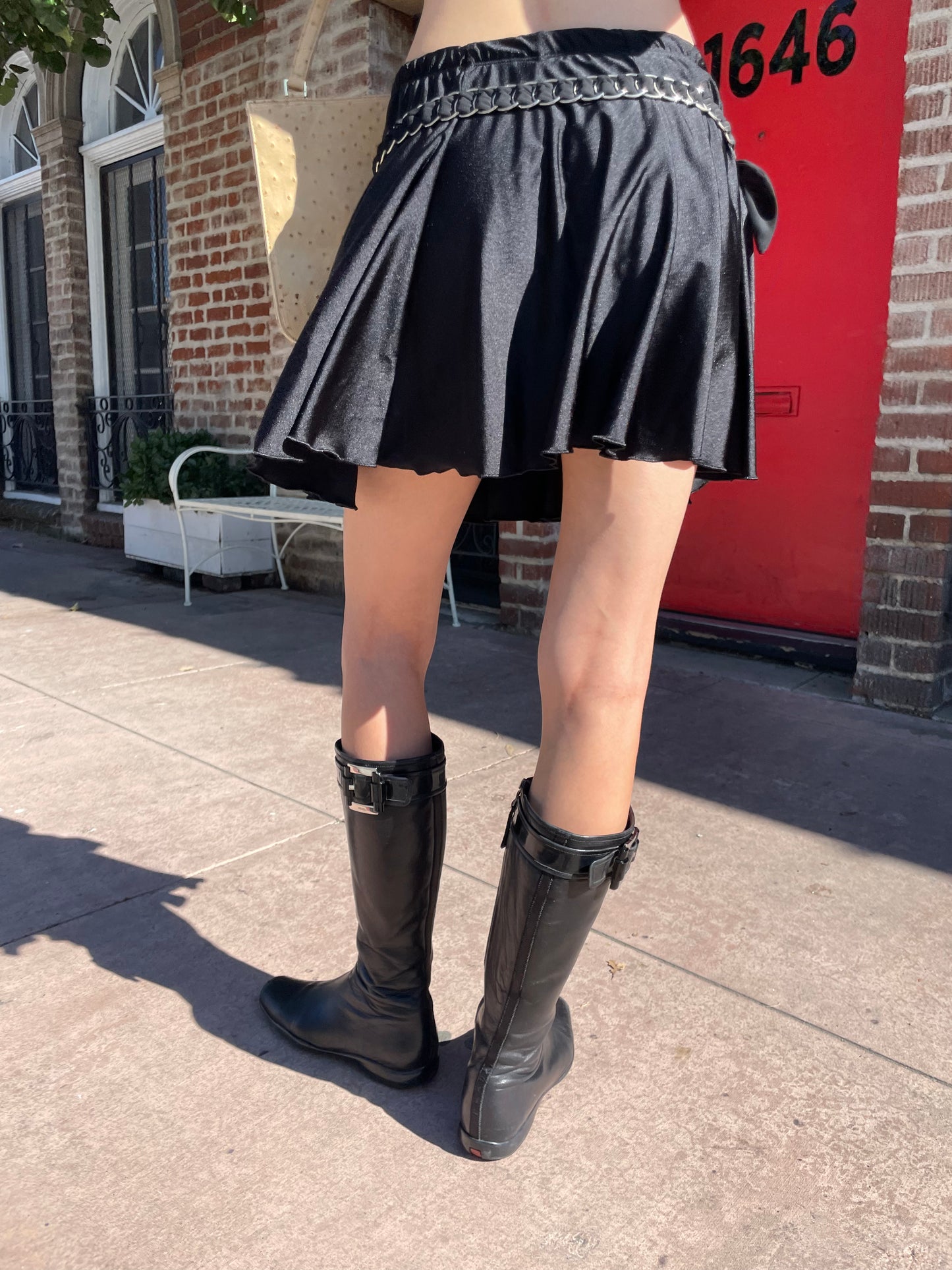 girl in yellow button up and black skirt