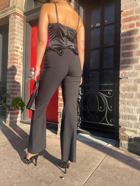 girl wearing black pants and black and red corset